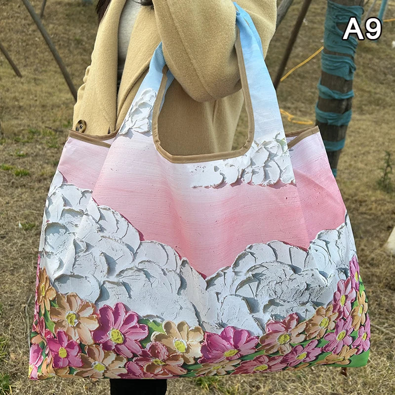 A reusable shopping tote bag featuring a watercolor pink and white floral design.