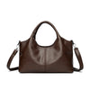 A dark brown leather casual crossbody shoulder bag with a top handle and zip closure.