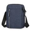 A navy blue durable waterproof crossbody bag with black trim and strap.