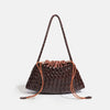 A dark brown handwoven PU shoulder bag with a braided strap and drawstring closure.