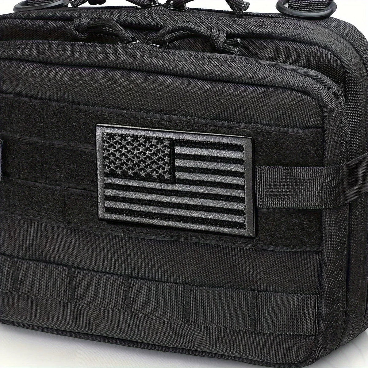 Black fabric pouch with a rectangular American flag embroidery patch on the front
