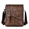 A brown men's PU leather messenger bag with a dark strap shown from the front.