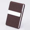 A dark brown patterned PU leather business card holder with a white card slot.
