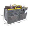 A gray multi-pocket organizer tote bag filled with cosmetic and essential items like brushes and makeup.