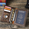 A brown leather passport card holder displaying a passport and various cards on a wooden surface.
