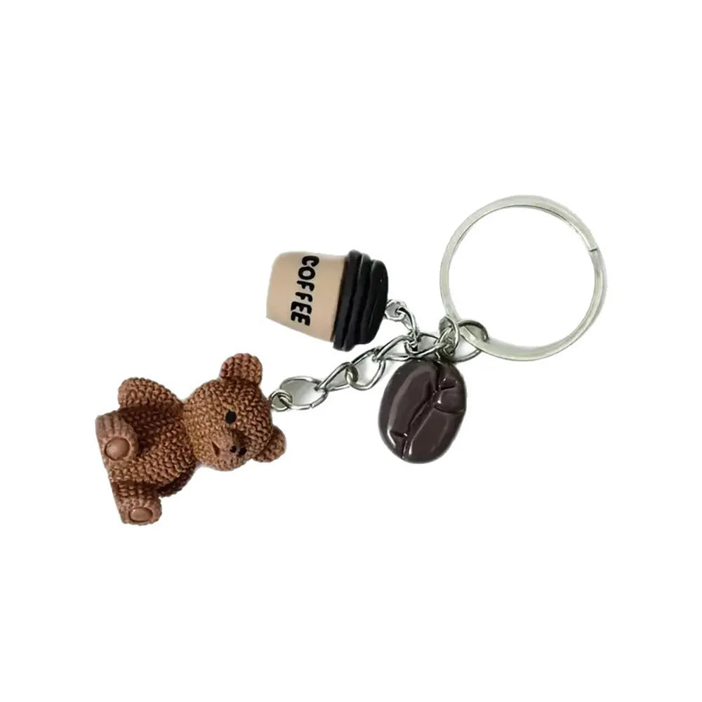 A brown 3D bear pendant keychain with a coffee filter attached.