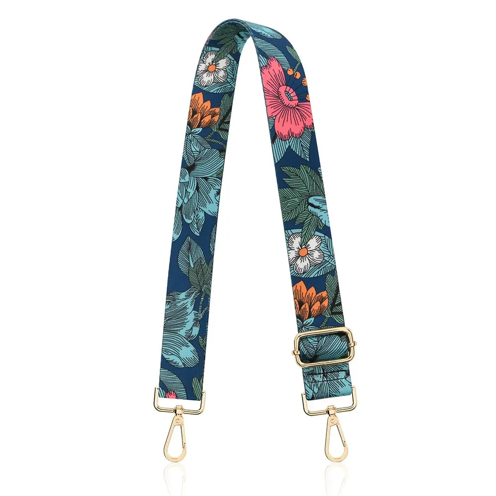 A floral patterned nylon crossbody bag strap featuring teal, orange, and pink flowers.
