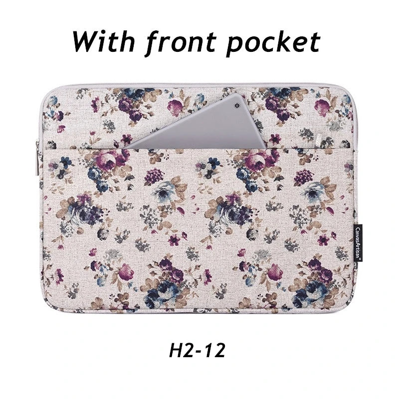 A light pink floral patterned laptop sleeve with a front pocket for a MacBook Pro.