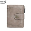 A light taupe leather wallet with perforated detailing and a gold-colored accent, designed for RFID protection.
