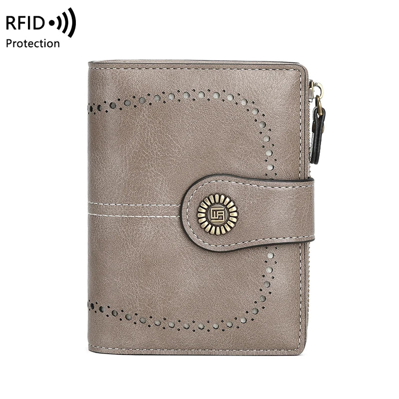 A light taupe leather wallet with perforated detailing and a gold-colored accent, designed for RFID protection.