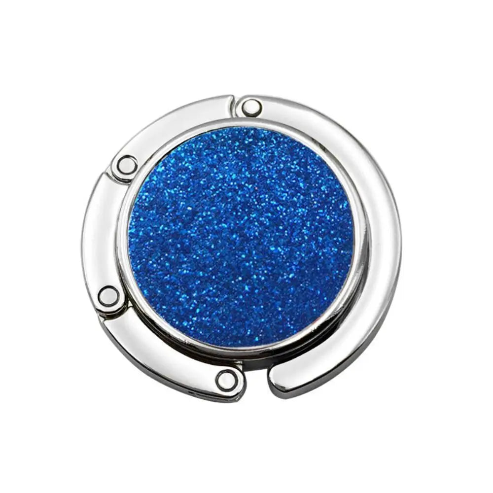 A round, shiny metal desk hook with a vibrant blue glitter finish.