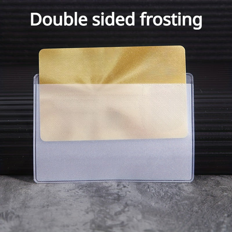 Double sided frosting card protector sleeves in gold and silver colors displayed on a dark surface.
