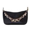 Black crocodile print handbag with a gold beaded chain and dangling charms