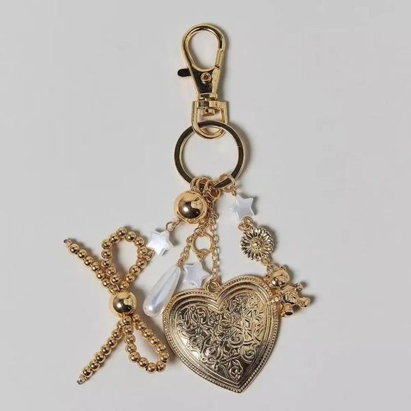 Gold aesthetic evil eye lanyard keychain charm with a heart pendant and star accents