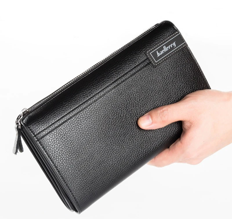 A black leather business handbag clip wallet is held by a hand, showing the texture and branding.