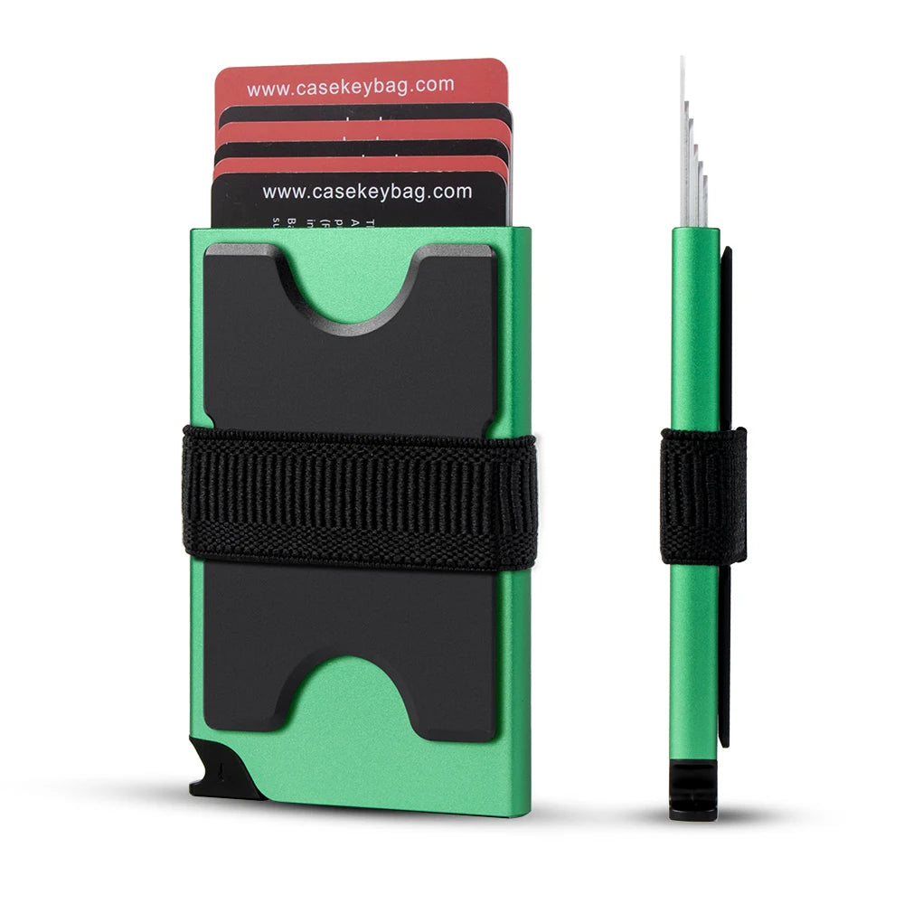 A green card wallet with a black strap and a green metal pop-up card holder next to a green pen.