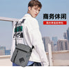 A young man is holding a gray sports sling bag in front of a city skyline.