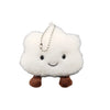 A white fluffy cloud shaped plush toy with a smiling face and a silver chain pendant.