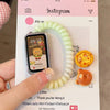 A close-up photo shows a white elastic watch strap wrapped around a smartphone displaying an Instagram post.