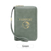 A green passport holder wallet with a gold clasp and wrist strap, featuring a globe design.