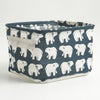 A dark blue and white patterned waterproof cotton linen storage basket for desk organization.