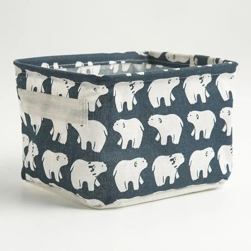 A dark blue and white patterned waterproof cotton linen storage basket for desk organization.