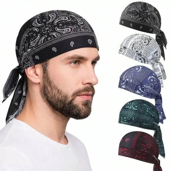 A man models a black paisley bandana style sports headband with white and blue patterns.