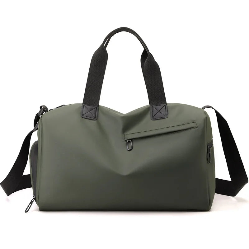A olive green waterproof travel duffle bag with black straps and a separate shoe compartment.