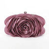 A mauve rose floral evening clutch bag with a silver chain strap.