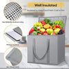 A gray foldable insulated grocery and food cooler bag filled with fresh fruits and vegetables.