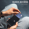 A hand holds a black wallet with an Airtag slot, demonstrating quick access functionality.