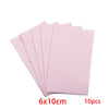 A stack of ten pink polishing cloths measuring 6 by 10 cm for silver and gold jewelry.