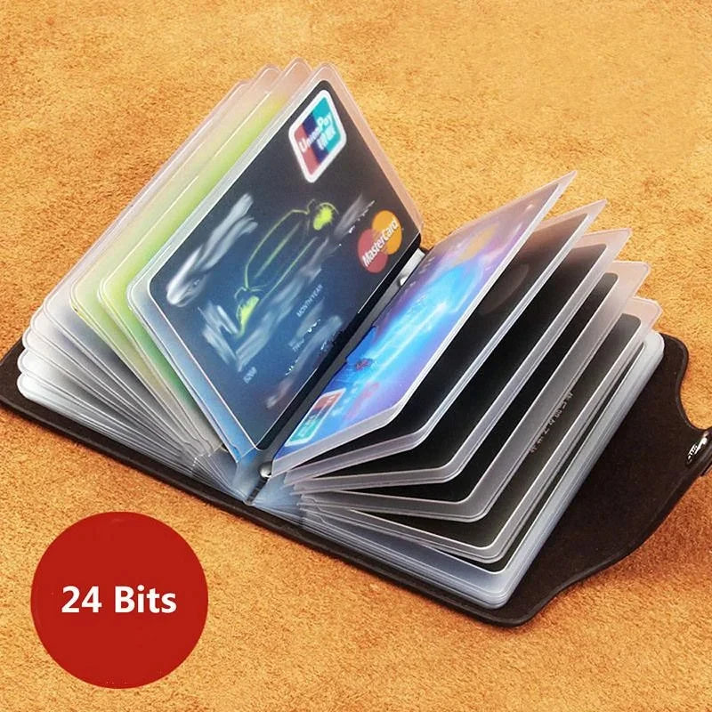 A stack of clear plastic cards, including a credit card and ID, is displayed in a black leather wallet on a wooden surface.