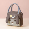 A brown insulated thermal picnic lunch bag for kids with a cute bear face design and gray straps.
