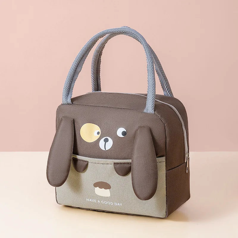 A brown insulated thermal picnic lunch bag for kids with a cute bear face design and gray straps.