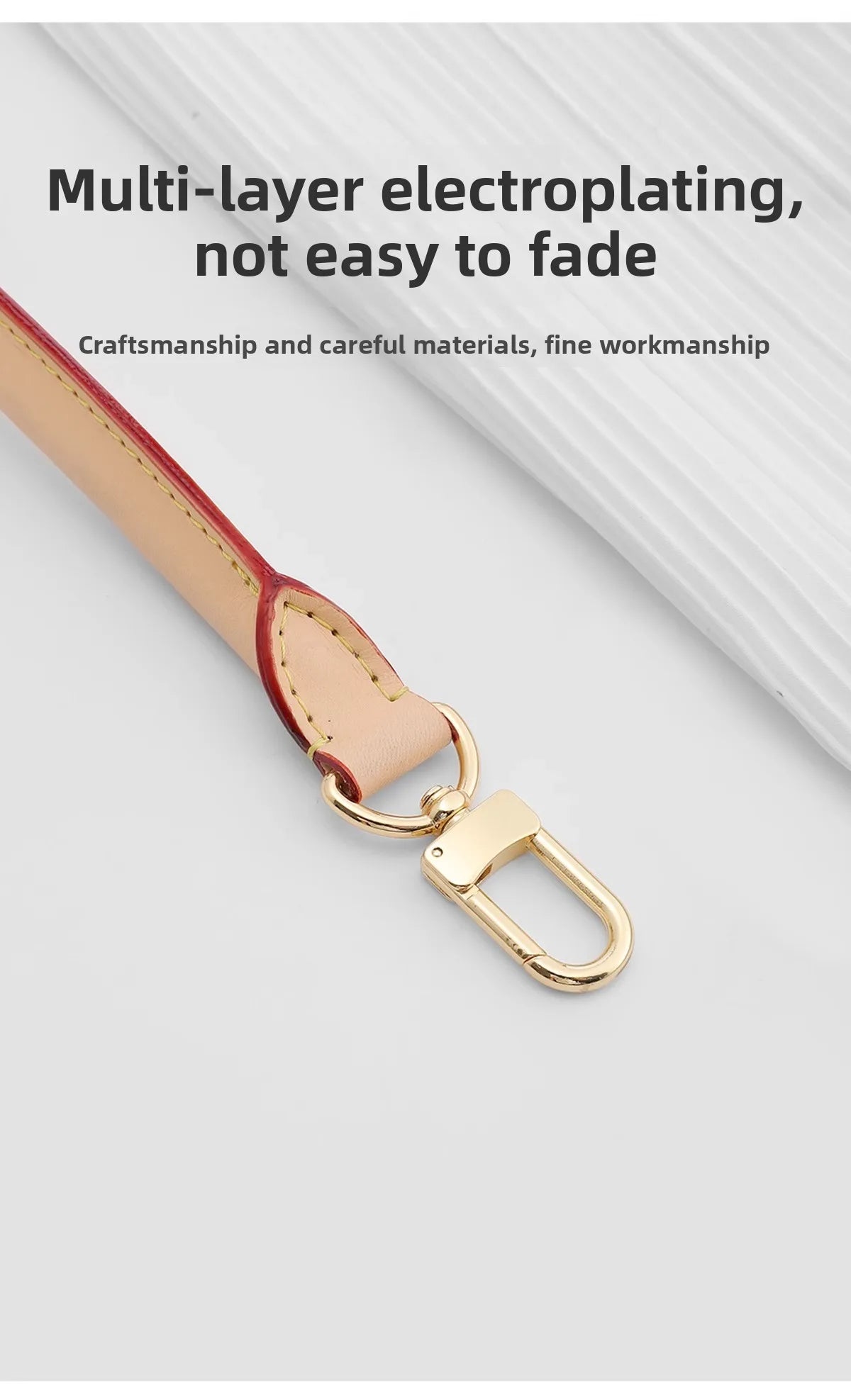A close-up of a light tan leather strap with a gold-toned metal clasp, showing multi-layer electroplating finish.