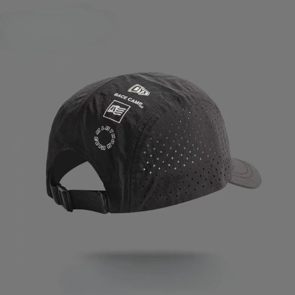 A black Dyx base camp mesh baseball cap is shown from above.