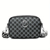 Black faux leather crossbody bag with a repeating monogram pattern and silver hardware