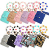 A collection of twelve silicone bead and leather card wallets in various pastel and dark colors displayed on a white backgrou