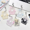 A collection of acrylic photocard holders shaped like angels with wings and hearts in various pastel colors