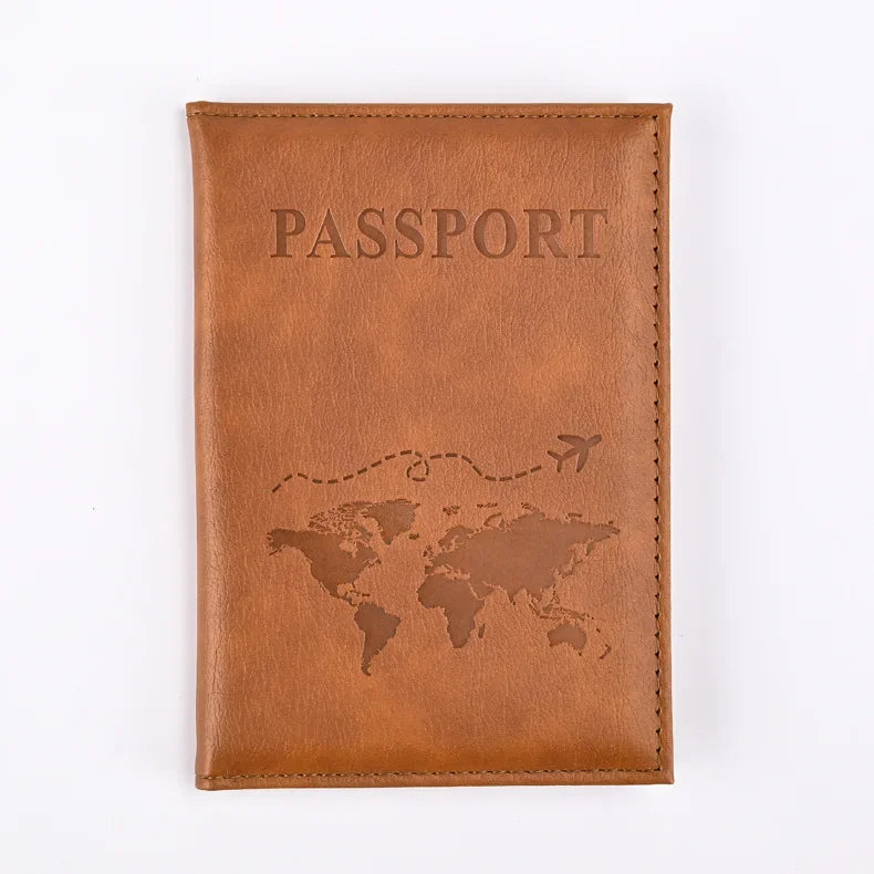 A brown leather passport holder with the word PASSPORT embossed and a silhouette of the world map.