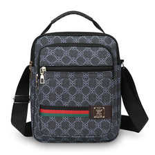 A black patterned sling bag with a black strap and gold hardware.