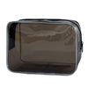 A transparent PVC travel makeup bag with a black zipper closure.