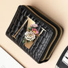 A black PU leather double-zip clutch wallet with a gold accent and a floral cartoon print.