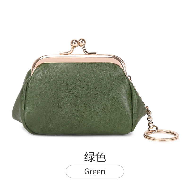 A dark olive green leather coin purse with a gold-toned clasp and chain attached.
