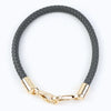 A black PU leather replacement bag strap with gold-toned metal buckles.