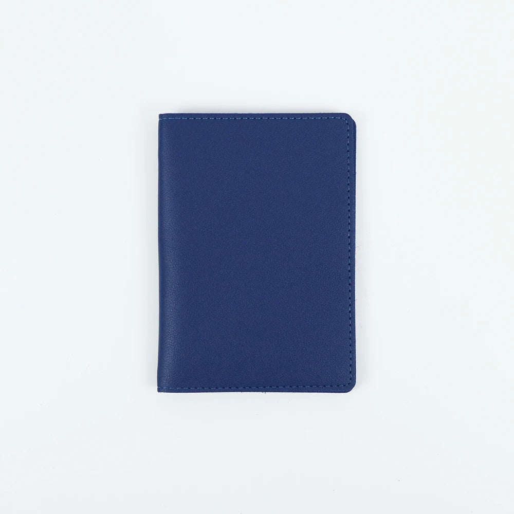 A dark blue customizable PU leather passport holder with a smooth finish.
