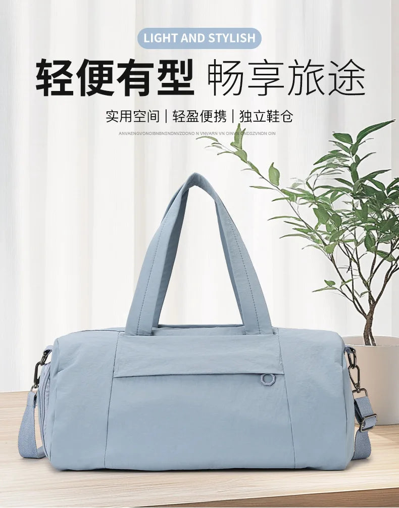A light blue Oxford gym duffel bag with a padded handle is shown against a white background.