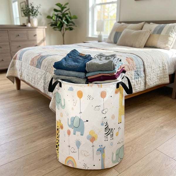 A white canvas laundry and storage basket decorated with colorful animal illustrations like elephants, zebras, and rainbows.