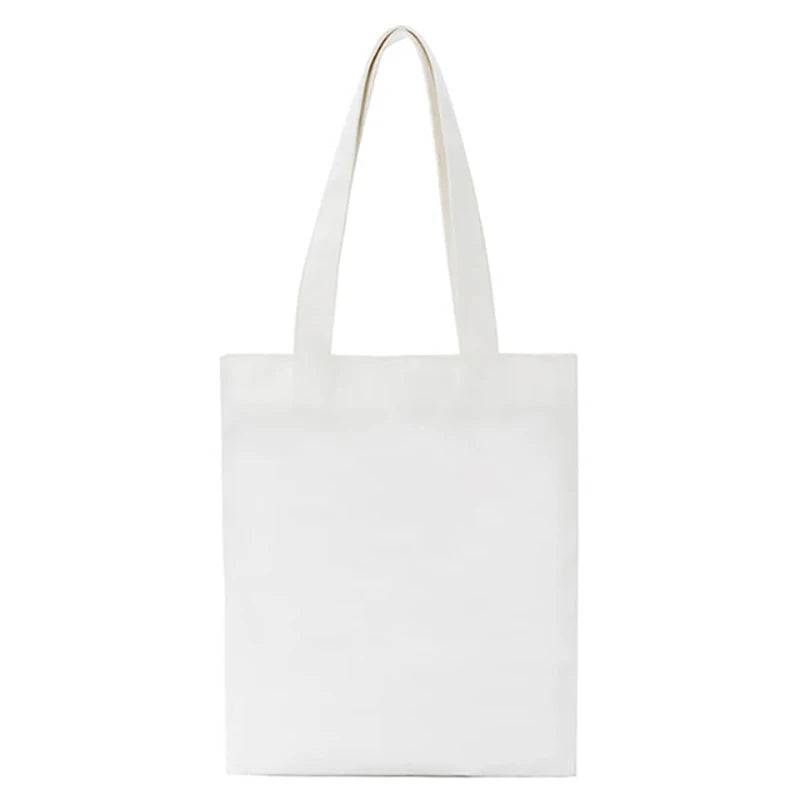 Sac de courses en toile blanche avec une poignée dorée.